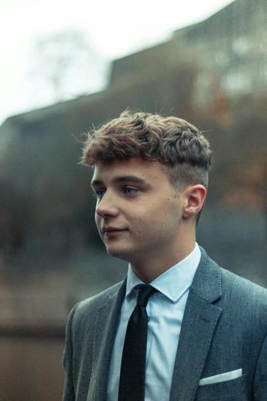 a close up of a person wearing a suit and tie, by Nick Fudge, wavy and short top hair, male teenager, lgbtq, music