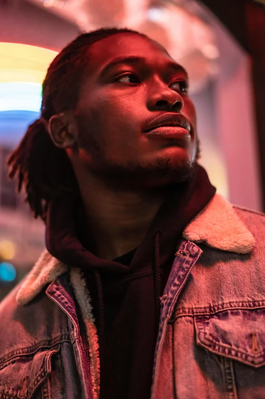 a close up of a person wearing a jacket, trending on pexels, ( ( dark skin ) ), good lighted photo, young male, promotional photo