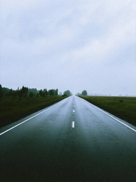 an empty road in the middle of a field, an album cover, unsplash, rainy; 90's photograph, college, dasha taran, long highway