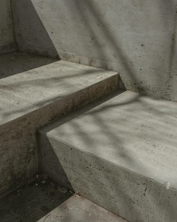 a cat that is sitting on some concrete steps, an album cover, inspired by Tadao Ando, unsplash contest winner, concrete art, brutalist futuristic interior, background image, volumetric light and shadow, thumbnail