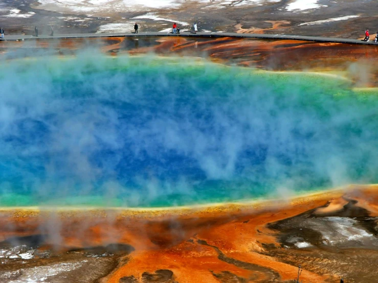 a large blue pool of water surrounded by snow, pexels contest winner, hurufiyya, with veins of magma and gold, green gas spreading across land, people watching around, hunting