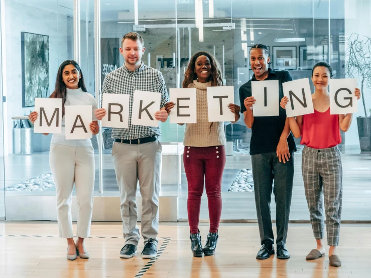 a group of people holding signs that say marketing, by Matija Jama, pexels contest winner, square, full body image, commercial banner, thumbnail