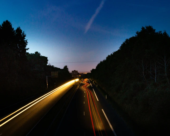 a long exposure photo of a highway at night, an album cover, unsplash, realism, summer evening, night time footage