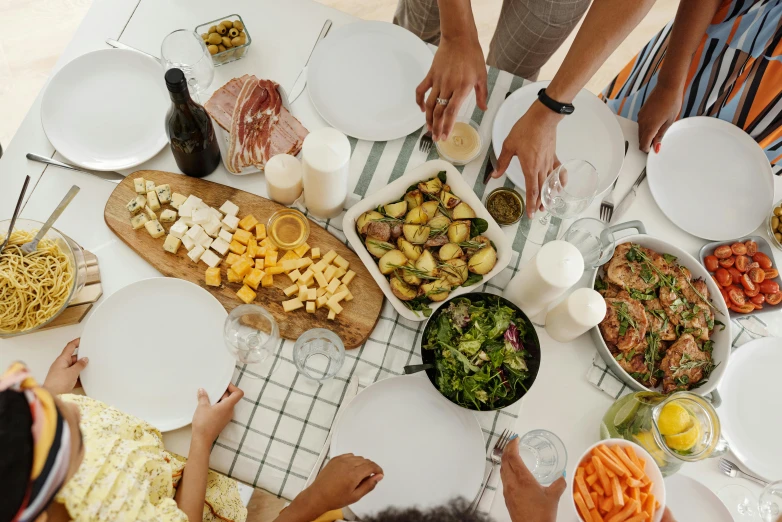 a group of people standing around a table filled with food, by Carey Morris, pexels contest winner, renaissance, white kitchen table, australian, holiday, 15081959 21121991 01012000 4k