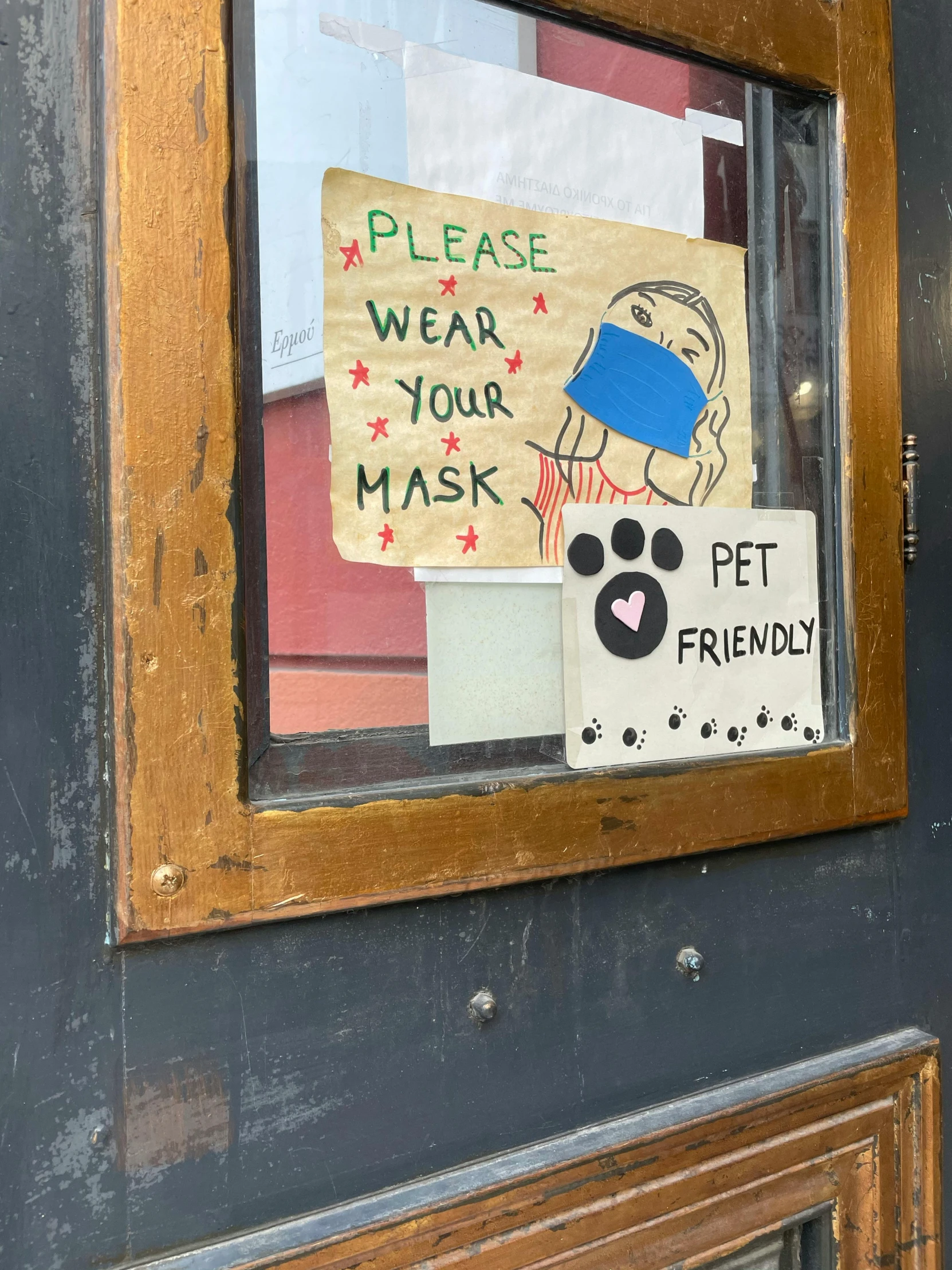 a door with a sign that says please wear your mask, by Bernie D’Andrea, temporary art, pets, humans of new york style, friendly, no restaurant