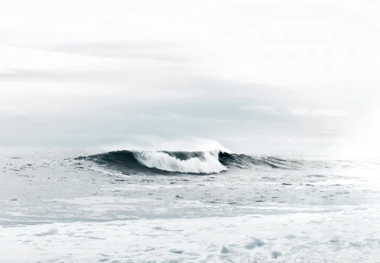 a man riding a wave on top of a surfboard, pexels contest winner, minimalism, pure white overcast sky, apocalyptic tumultuous sea, ocean wave, monochromatic photo