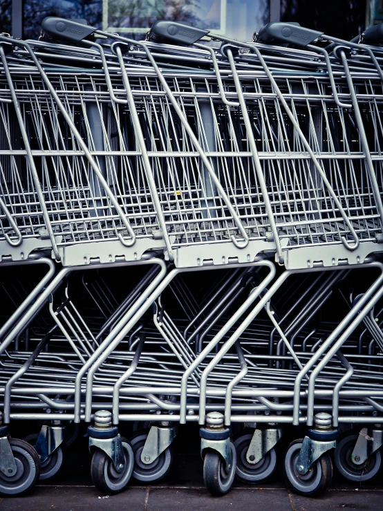 a bunch of shopping carts sitting next to each other, by Carey Morris, pexels, photorealism, ilustration, full frame image, graphic print, award winning photo