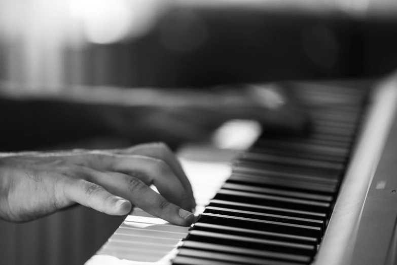 a close up of a person playing a piano, by Patrick Pietropoli, 4k greyscale hd photography, profile image