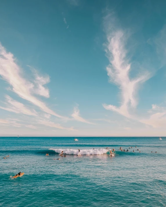 a group of people riding surfboards on top of a wave, pearly sky, thumbnail, clear blue water, multiple stories