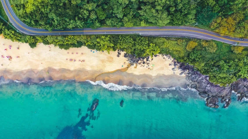 an aerial view of a road next to the ocean, a digital rendering, pexels contest winner, hawaii beach, lush paradise, thumbnail, slide show