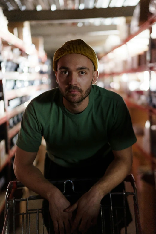 a man sitting in a shopping cart in a store, a portrait, pexels contest winner, beanie, charlie cox, promotional image, jacksepticeye