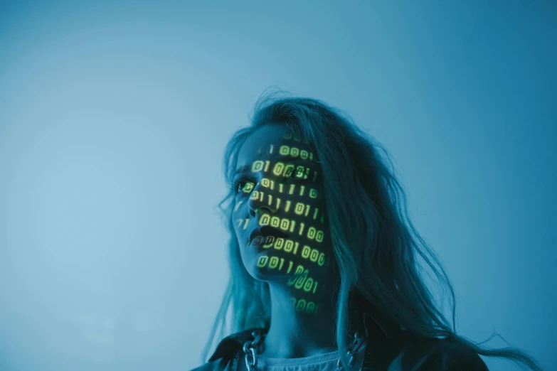 a woman holding a cell phone in front of her face, a hologram, by Adam Marczyński, trending on pexels, ascii art, cybernetic dreadlocks, creative coder with a computer, cybersuit, profile image