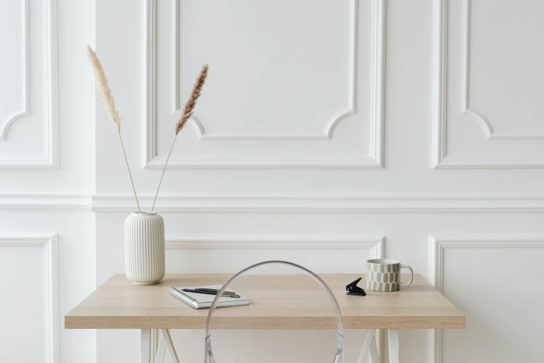 a white vase sitting on top of a wooden table, a minimalist painting, trending on pexels, headphone stand, background image, white sweeping arches, on clear background