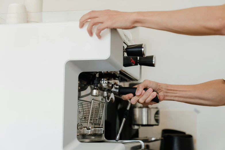 a close up of a person using a coffee machine, profile image, white mechanical details, thumbnail, no watermarks