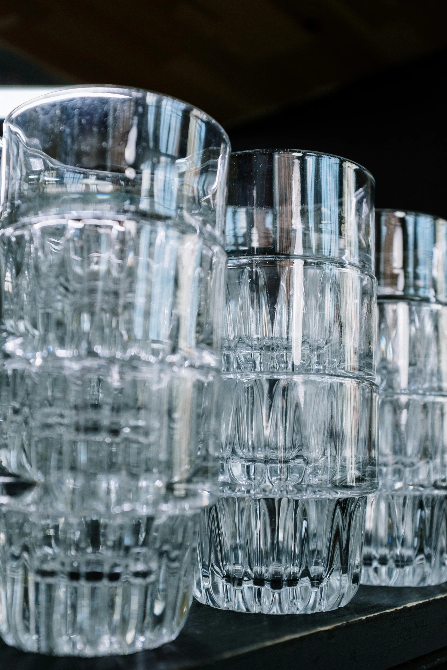 a row of glasses sitting on top of a shelf, crystal cubism, stacked, fine dining, unbeatable quality, multiple stories