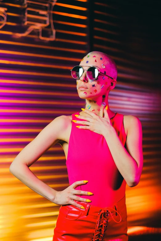 a woman in a pink top and red pants, inspired by David LaChapelle, pexels, antipodeans, emaciated shaved face, futuristic sunglasses, skin made of led point lights, profile image
