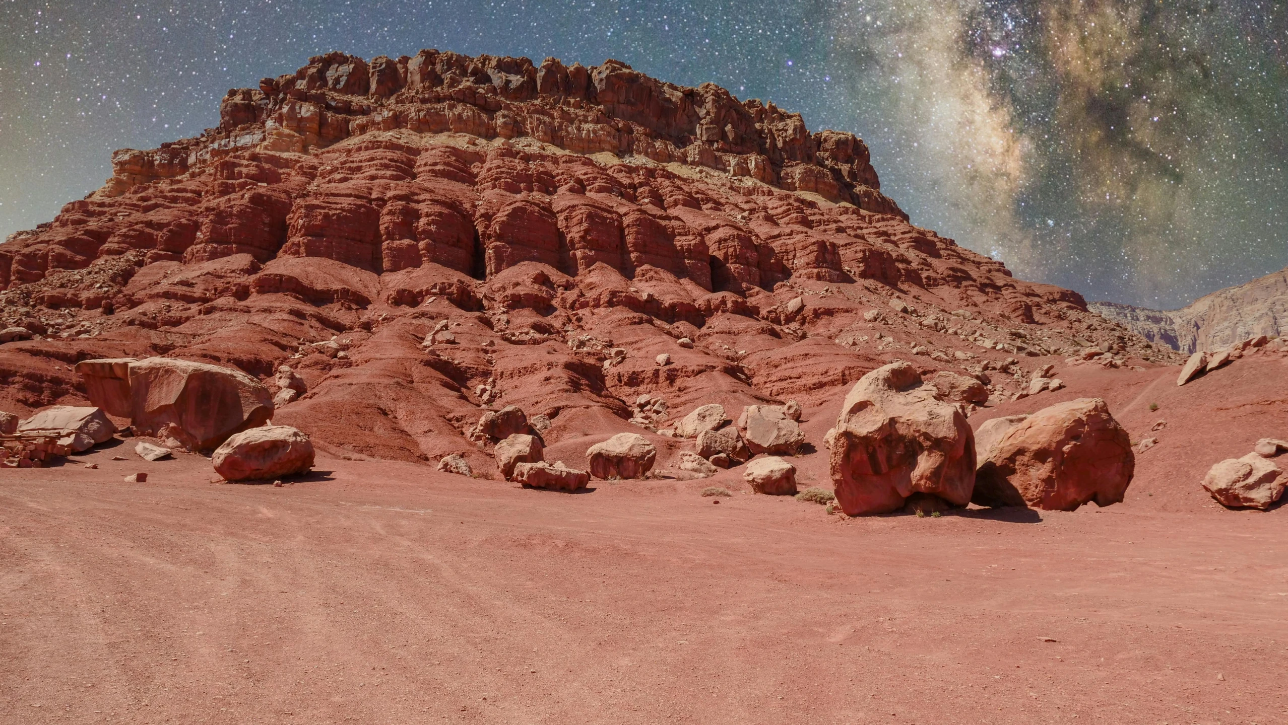 a group of large rocks sitting in the middle of a desert, a matte painting, pexels contest winner, stars and planets visible, red sandstone natural sculptures, shiny layered geological strata, beach on the outer rim