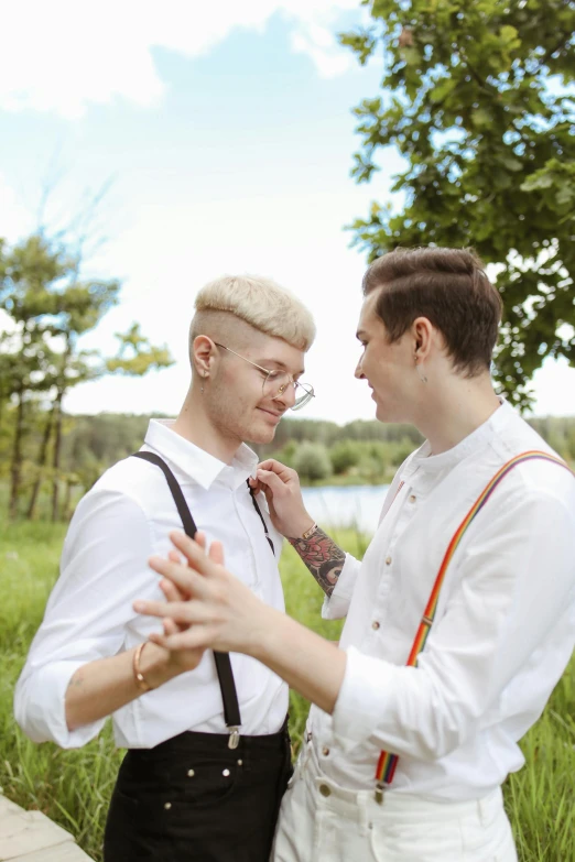 a couple of men standing next to each other, trending on pexels, albino hair, wedding photo, greens), ukrainian