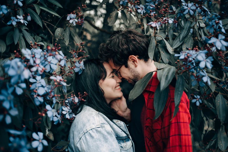 a man and a woman standing next to each other, pexels contest winner, romanticism, flowers on heir cheeks, with soft bushes, avatar image, cuddling