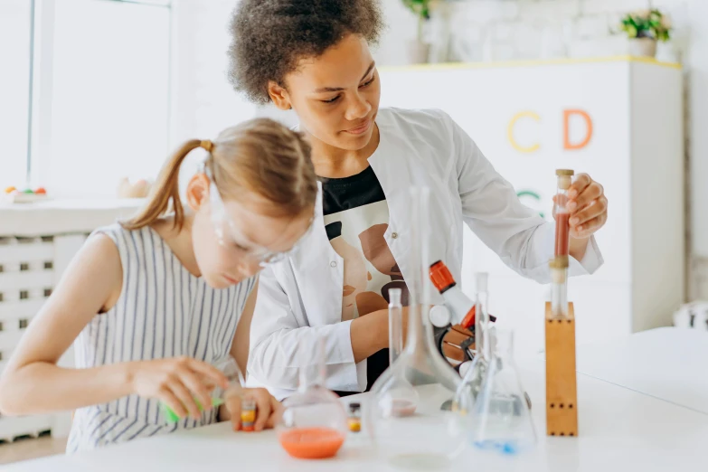 a woman teaching a young girl how to make a science experiment, pexels contest winner, analytical art, profile image, 1 2 9 7, thumbnail, private school