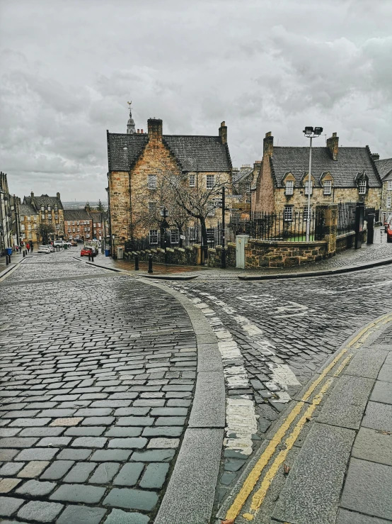 a red fire hydrant sitting on the side of a road, an album cover, by IAN SPRIGGS, pexels contest winner, renaissance, edinburgh castle, staggered terraces, intersection, just after rain