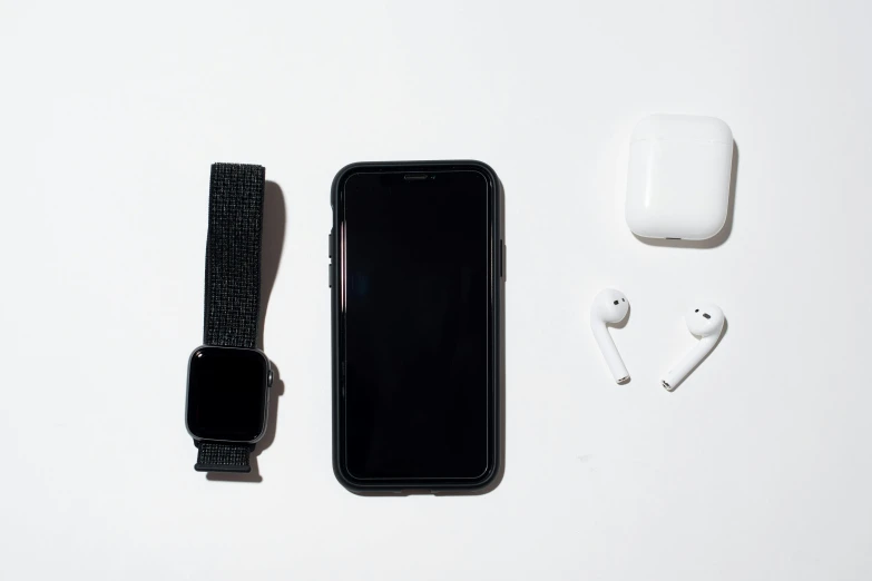 an apple watch, apple airpods, and earphones laid out on a white surface, a still life, minimalism, black main color, square, white background : 3, iphone picture