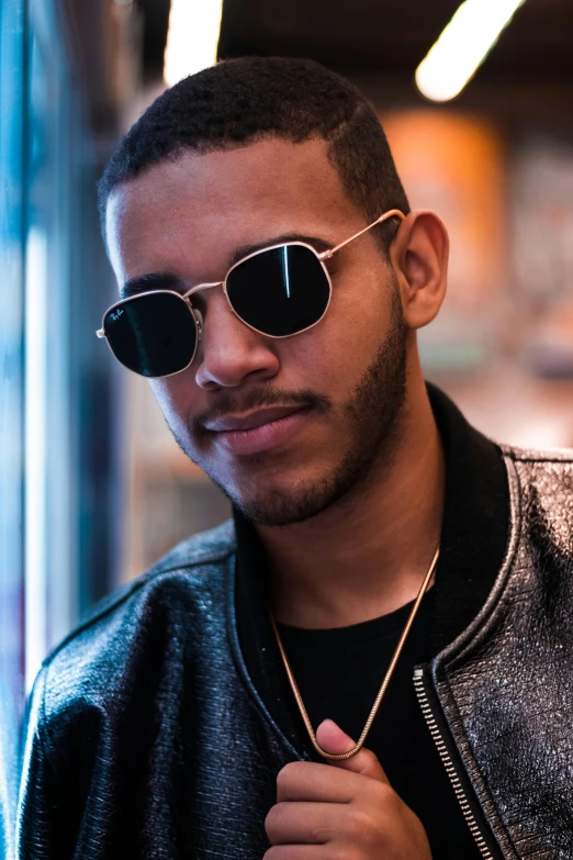 a close up of a person wearing sunglasses, inspired by Michael Ray Charles, trending on pexels, mixed race, portrait of danny gonzalez, stylish pose, teddy fresh