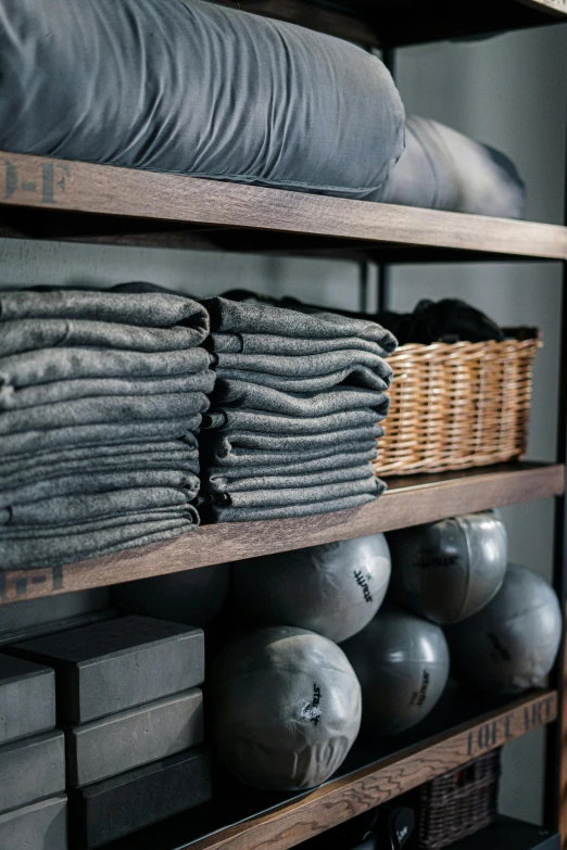 a shelf filled with lots of pillows and blankets, by Jason Felix, unsplash, renaissance, athletic crossfit build, in gunmetal grey, organic detail, uniform