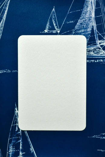 a white square on a blue background with sailboats, unsplash, playing card back, large format picture, fine texture, no - text no - logo