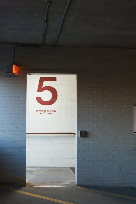 a fire hydrant sitting in the middle of a parking garage, by David Simpson, temporary art, exactly 5 fingers, in an elevator, r-number, crimson and white color scheme