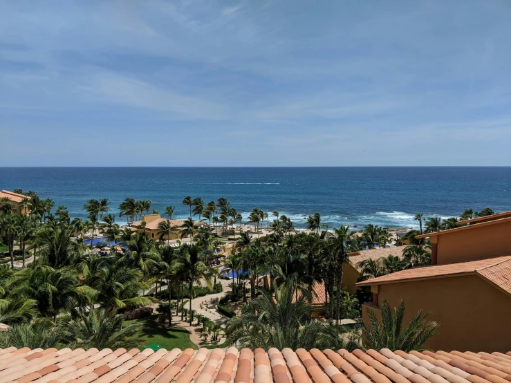 a view of the ocean from the roof of a building, despacito, resort, profile image