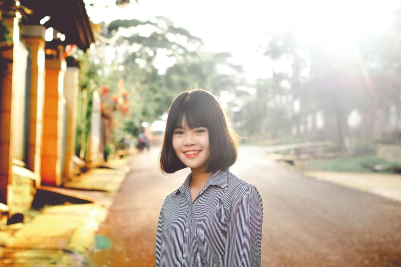 a woman standing in the middle of a road, a picture, inspired by Ruth Jên, pexels contest winner, young cute wan asian face, medium format. soft light, avatar image, with a bob cut