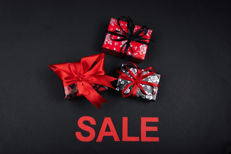 a couple of presents sitting on top of a black background, instagram, sales, red - black, 3 - piece, graphic print