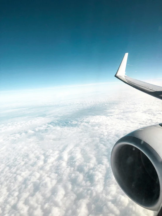 an airplane is flying high above the clouds, happening, accidental selfie, taken in 2022, fan favorite, jet engines