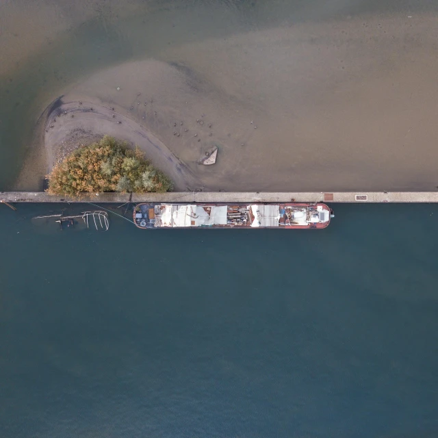 a large boat sitting on top of a body of water, by Attila Meszlenyi, satelite imagery, thames river, near a jetty, 15081959 21121991 01012000 4k
