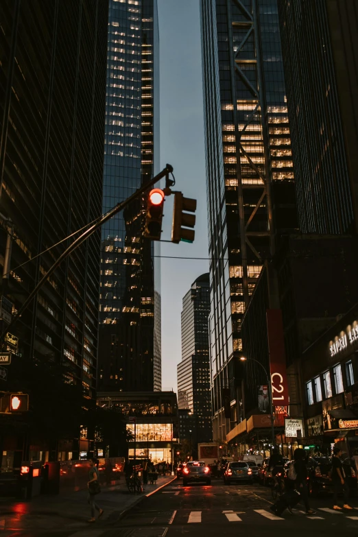 a city street filled with lots of tall buildings, by Adam Rex, pexels contest winner, street light, new york streets, glowing street signs, instagram story