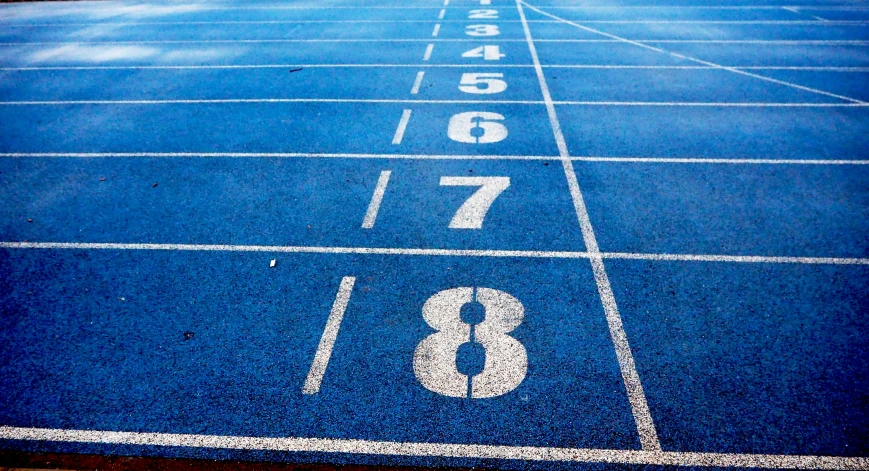 a blue running track with numbers on it, an album cover, pexels, journalism photo, square, scores, blog-photo