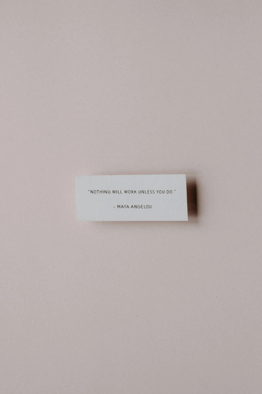 a piece of paper sitting on top of a table, by Rebecca Horn, unsplash, conceptual art, beautiful brand labels, moma, miniature porcelain model, back