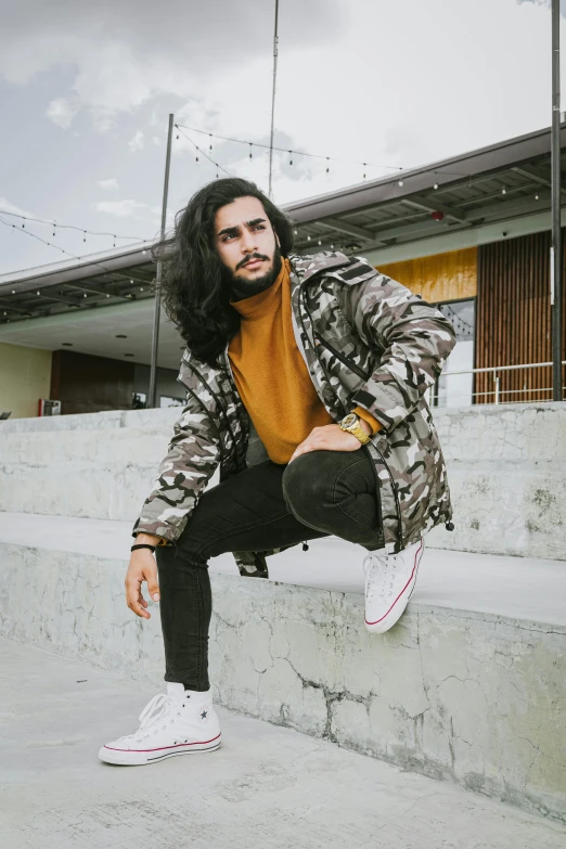 a man sitting on the steps of a building, by Robbie Trevino, wearing camo, young with long hair, man standing in defensive pose, kyza saleem