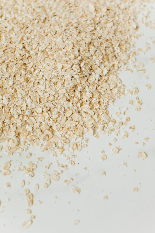 a pile of oatmeal sitting on top of a table, detailed product image, detail shot, thumbnail, crushed