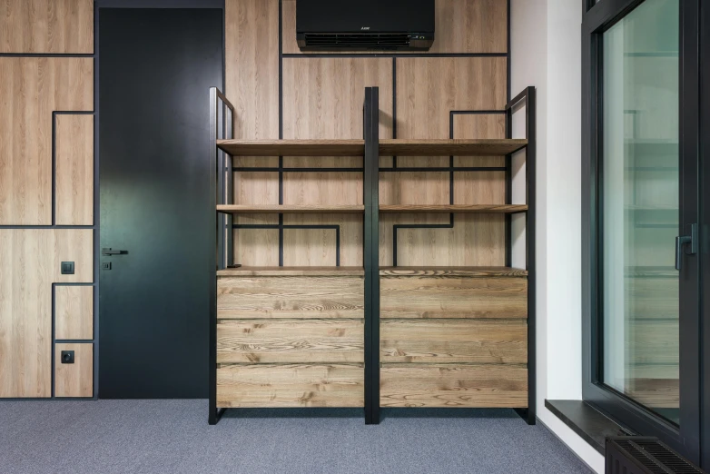 a room with shelves and a television mounted on the wall, by Adam Marczyński, unsplash, lacquered oak reception desk, athletic crossfit build, metalwork, neo kyiv