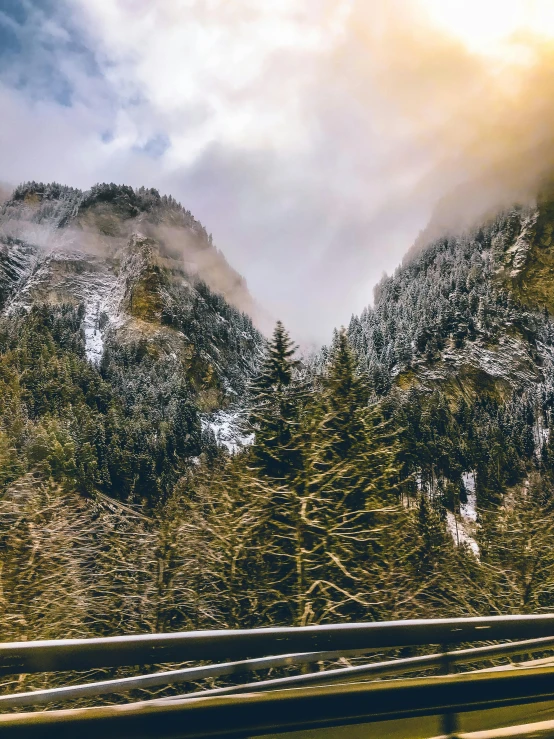 a view of the mountains from a moving car, by Sebastian Spreng, pexels contest winner, renaissance, lush winter forest landscape, ominous! landscape of north bend, today\'s featured photograph 4k, canyon