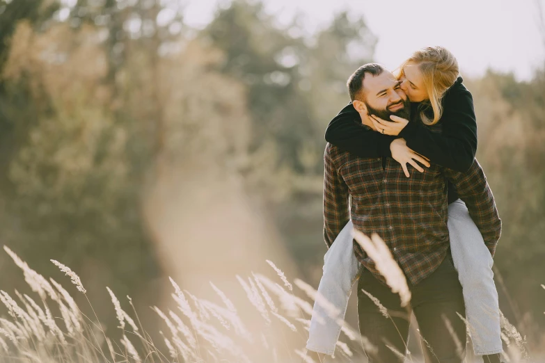 a man carrying a woman on his back in a field, pexels contest winner, profile image, fan favorite, soft light, youtube thumbnail