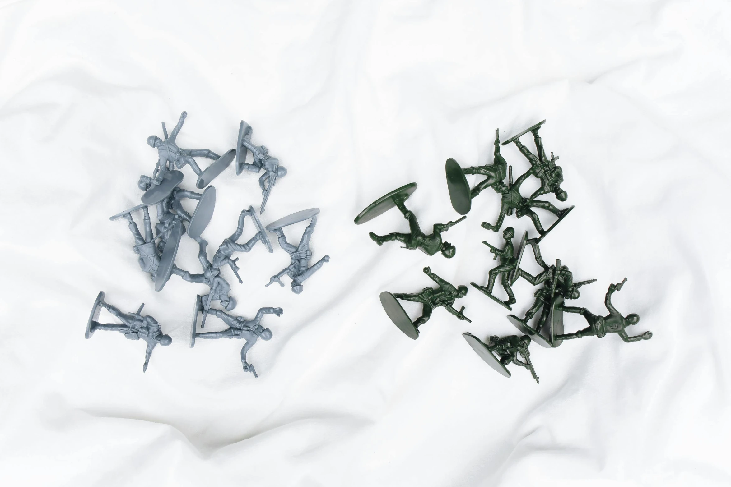 a bunch of toy soldiers laying on top of a white sheet, unsplash, visual art, game asset of fighters, grey, enamel, close-up product photo