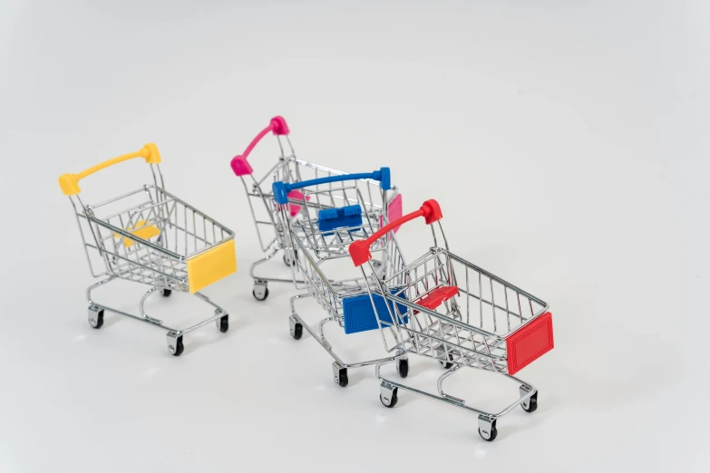 three shopping carts sitting side by side on a white surface, a picture, pexels, figuration libre, model miniature, multi colour, banpresto, 3 d product render