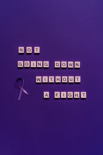 a sign that says not going down without a fight, pexels contest winner, conceptual art, purple ribbons, disease, instagram post, profile image