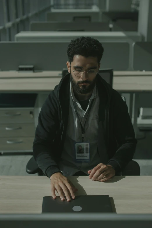 a man sitting at a desk with a laptop, inspired by Pablo Munoz Gomez, serial art, worksafe. cinematic, h3h3, ( ( theatrical ) ), hunting