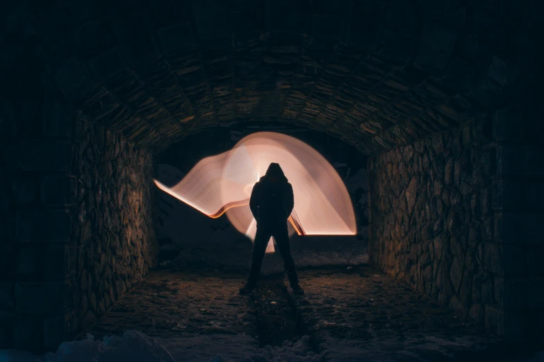 a person standing in a tunnel at night, unsplash contest winner, visual art, in an igloo, light tracing, wallpaperflare, instagram post