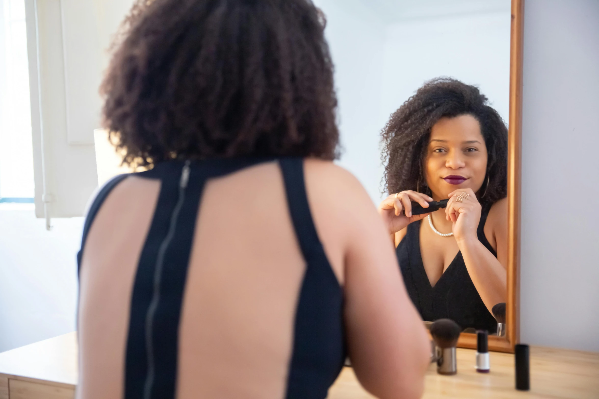 a woman brushing her teeth in front of a mirror, by Jacqui Morgan, pexels contest winner, happening, mixed-race woman, curvy build, avatar image, decolletage