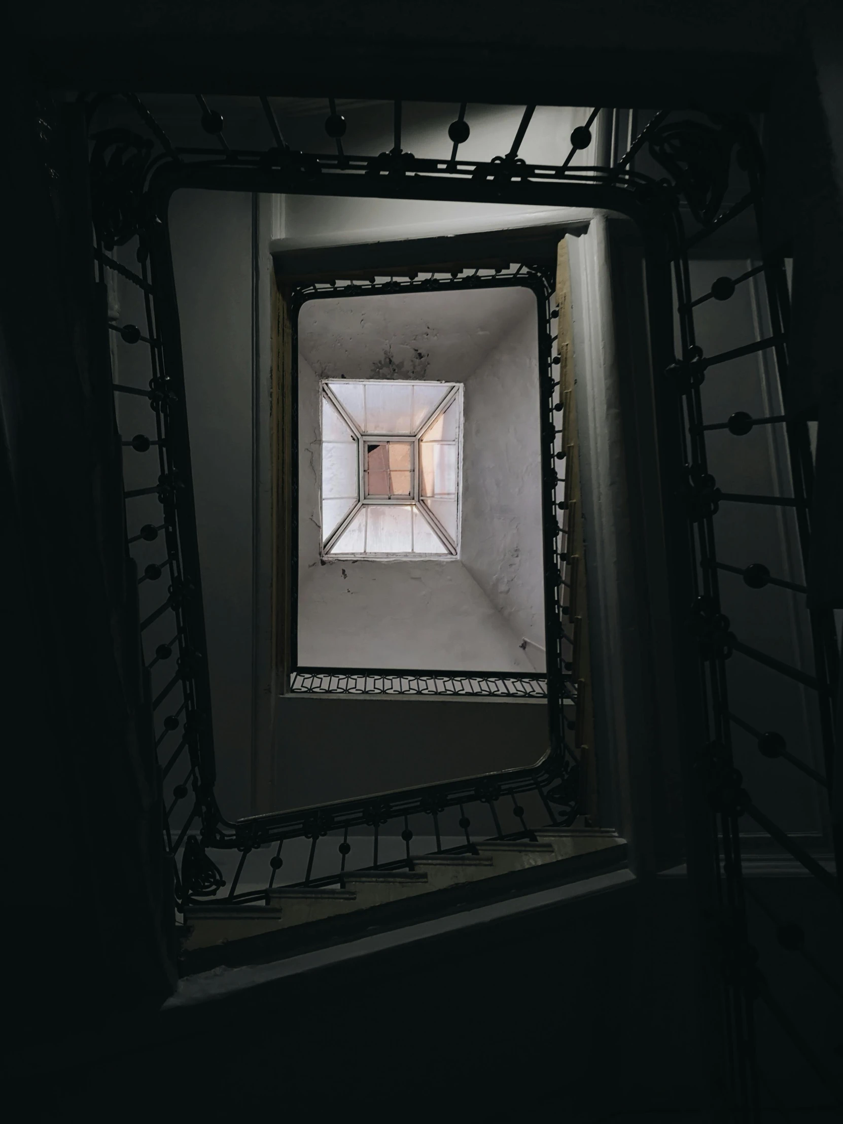 a staircase with a window in the middle of it, inspired by M.C. Escher, unsplash contest winner, ignant, an escape room in a small, room of a dark mansion, square